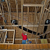 CSPics > 02-03-07

My son-in-law Matt, installs / supervises / programs home theater / home automation projects for a Maryland based company.  I convinced the builder to let Matt do "rough-in" wiring for me in my new home.  Ceiling speakers, Cat5 cable to most rooms, etc.  My brother-in-law assisted us doing the project.  Here he is in the loft doing ceiling speakers (rough-in).

My thanks to them for their generous assistance - on what will probably be the coldest Saturday for this area, this year (low 20's with a formidable wind).