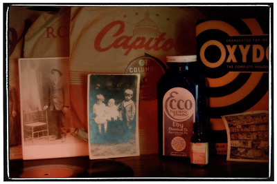 03-06-08

Heritage

We have a guest bedroom that my wife calls the Heritage Room.  The wall have photos of her ancestors, and similar items are found on the shelves.  These are photos and things she collected from her parents home when they were alive.  Her parents owned a tiny grocery in a town so small there was no traffic light - some of the items in this shot were remnants from the store.

I closed the blinds, set the smallest aperture on my Nikon, and used a flashlight to do "light painting" to make this shot.
